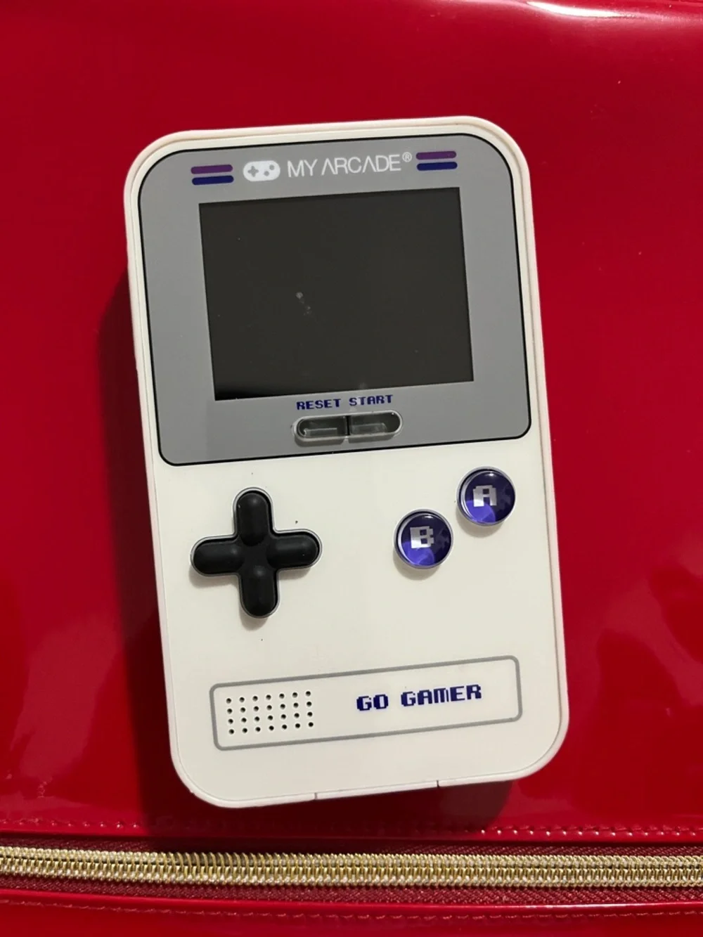 Arcade GO GAMER White Handheld Console with Black D-pad and Purple Buttons